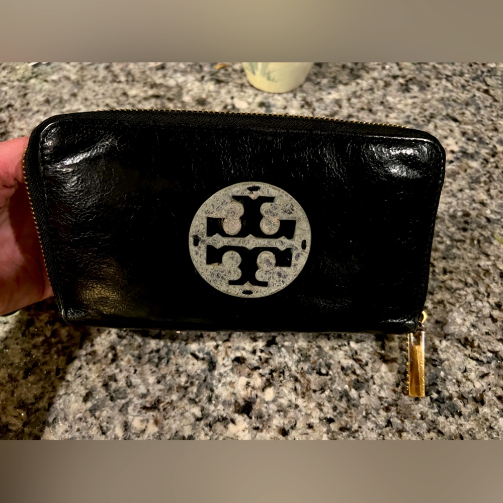 Tory Burch black zip wallet.